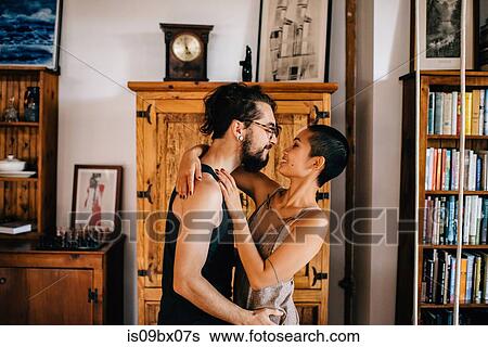 Couple hugging at home View Large Photo Image Stock Photograph - Couple hugging at home. Fotosearch