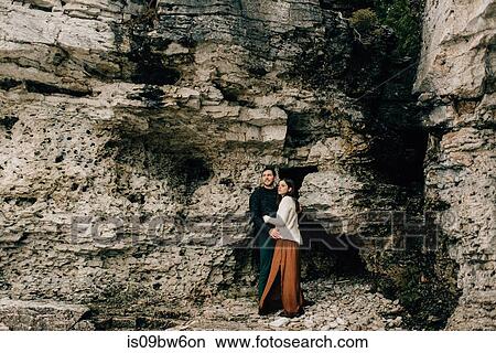 Couple hugging beside rock face, Tobermory, Canada View Large Photo Image Picture - Couple hugging beside rock face, Tobermory, Canada. Fotosearch