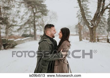 Couple hugging in snowy landscape, Georgetown, Canada View Large Photo Image Stock Image - Couple hugging in snowy landscape, Georgetown, Canada. Fotosearch