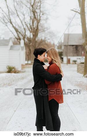 Couple hugging in snowy landscape, Georgetown, Canada View Large Photo Image Stock Image - Couple hugging in snowy landscape, Georgetown, Canada. Fotosearch