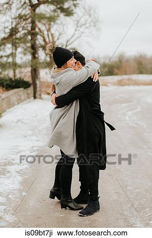 Couple hugging in snowy landscape, Georgetown, Canada View Large Photo Image Stock Image - Couple hugging in snowy landscape, Georgetown, Canada. Fotosearch