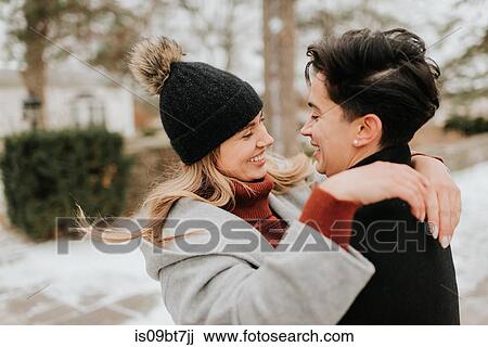 Couple hugging in snowy landscape, Georgetown, Canada View Large Photo Image Stock Image - Couple hugging in snowy landscape, Georgetown, Canada. Fotosearch