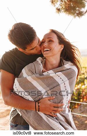 Couple hugging in vineyard, Cape Town, South Africa View Large Photo Image Stock Photo - Couple hugging in vineyard, Cape Town, South Africa. Fotosearch