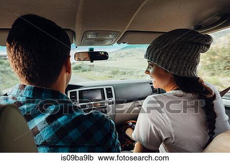Stock Image - Couple in car, on road trip, rear view, Silverthorne, Colorado, USA. Fotosearch