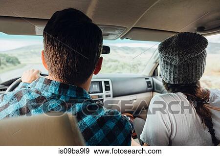 Couple in car, on road trip, rear view, Silverthorne, Colorado, USA View Large Photo Image Stock Photo - Couple in car, on road trip, rear view, Silverthorne, Colorado, USA. Fotosearch