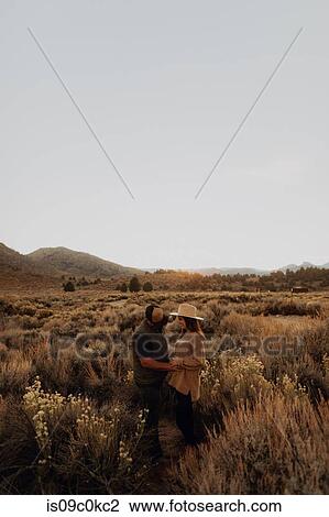 Couple in field landscape, Kennedy Meadows, California, US View Large Photo Image Stock Image - Couple in field landscape, Kennedy Meadows, California, US. Fotosearch