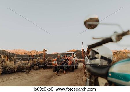 Couple in front of off road vehicle, Kennedy Meadows, California, US View Large Photo Image Stock Photo - Couple in front of off road vehicle, Kennedy Meadows, California, US. Fotosearch