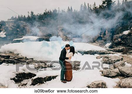Couple kissing in snow and rock landscape, Tobermory, Canada View Large Photo Image Stock Photography - Couple kissing in snow and rock landscape, Tobermory, Canada. Fotosearch