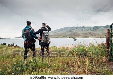 Picture - Couple near Dillon Reservoir, looking at view, Silverthorne, Colorado, USA. Fotosearch
