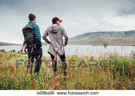 Stock Image - Couple near Dillon Reservoir, looking at view, Silverthorne, Colorado, USA. Fotosearch