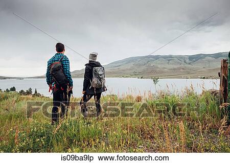 Stock Photography - Couple near Dillon Reservoir, looking at view, Silverthorne, Colorado, USA. Fotosearch