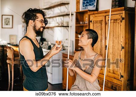 Couple on indoor swing View Large Photo Image Stock Photograph - Couple on indoor swing. Fotosearch