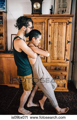 Stock Photograph - Couple playing at home. Fotosearch