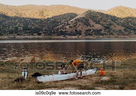 Couple preparing kayak by lake, Kaweah, California, United States View Large Photo Image Stock Image - Couple preparing kayak by lake, Kaweah, California, United States. Fotosearch
