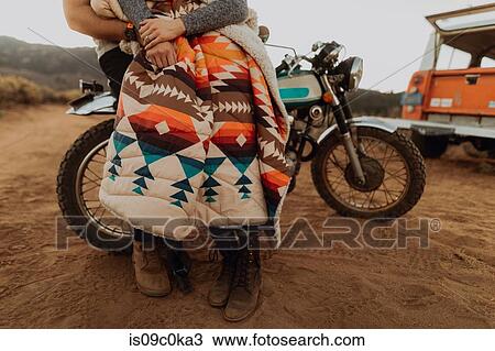 Couple relaxing on motorbike, Kennedy Meadows, California, US View Large Photo Image Stock Image - Couple relaxing on motorbike, Kennedy Meadows, California, US. Fotosearch