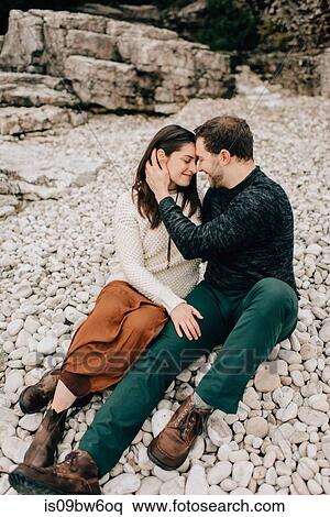 Couple sitting on rocky ground, Tobermory, Canada View Large Photo Image Stock Photography - Couple sitting on rocky ground, Tobermory, Canada. Fotosearch