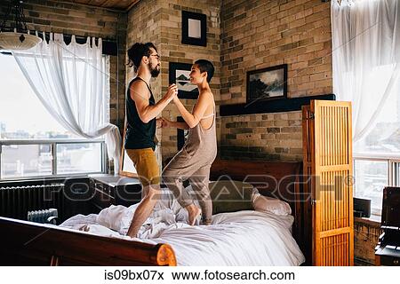 Couple slow dancing on bed View Large Photo Image Stock Photo - Couple slow dancing on bed. Fotosearch