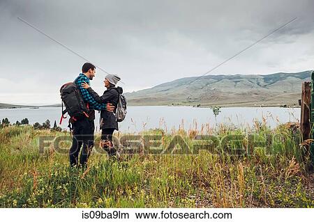 Couple standing beside Dillon Reservoir, face to face, Silverthorne, Colorado, USA View Large Photo Image Picture - Couple standing beside Dillon Reservoir, face to face, Silverthorne, Colorado, USA. Fotosearch