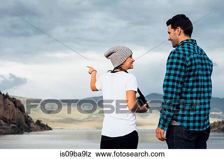 Couple standing on wall beside Dillon Reservoir, looking at view, Silverthorne, Colorado, USA View Large Photo Image Stock Photo - Couple standing on wall beside Dillon Reservoir, looking at view, Silverthorne, Colorado, USA. Fotosearch