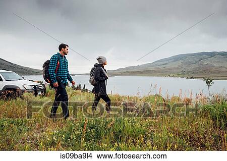 Couple walking beside Dillon Reservoir, Silverthorne, Colorado, USA View Large Photo Image Picture - Couple walking beside Dillon Reservoir, Silverthorne, Colorado, USA. Fotosearch