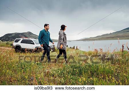 Couple walking beside Dillon Reservoir, Silverthorne, Colorado, USA View Large Photo Image Stock Image - Couple walking beside Dillon Reservoir, Silverthorne, Colorado, USA. Fotosearch