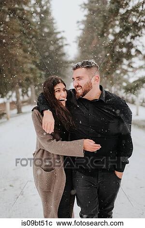 Couple walking in snowy landscape, Georgetown, Canada View Large Photo Image Stock Image - Couple walking in snowy landscape, Georgetown, Canada. Fotosearch