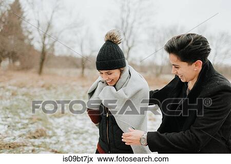 Couple walking in snowy landscape, Georgetown, Canada View Large Photo Image Stock Photo - Couple walking in snowy landscape, Georgetown, Canada. Fotosearch