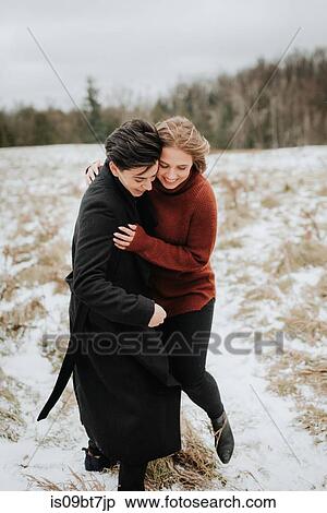 Couple walking in snowy landscape, Georgetown, Canada View Large Photo Image Stock Photography - Couple walking in snowy landscape, Georgetown, Canada. Fotosearch