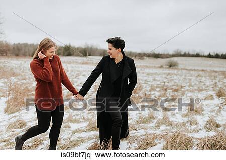 Couple walking in snowy landscape, Georgetown, Canada View Large Photo Image Stock Photography - Couple walking in snowy landscape, Georgetown, Canada. Fotosearch