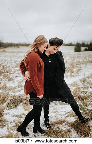 Couple walking in snowy landscape, Georgetown, Canada View Large Photo Image Stock Photography - Couple walking in snowy landscape, Georgetown, Canada. Fotosearch