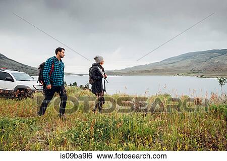 Stock Photograph - Couple walking near Dillon Reservoir, Silverthorne, Colorado, USA. Fotosearch