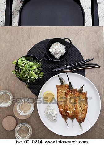 Picture - Crumbed garfish, tartare and herb salad. Fotosearch