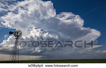 Cumulus congestus transforming into a cumulonimbus, windmill in foreground, Cope, Colorado, US View Large Photo Image Stock Photography - Cumulus congestus transforming into a cumulonimbus, windmill in foreground, Cope, Colorado, US. Fotosearch