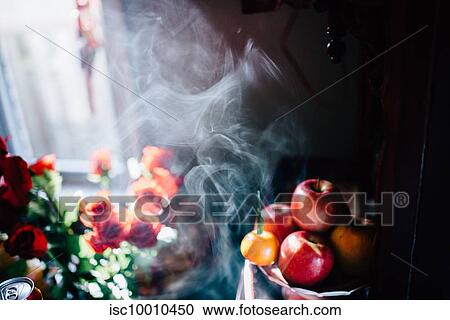 Detail of incense smoke, flowers and fruit at wedding reception View Large Photo Image Stock Image - Detail of incense smoke, flowers and fruit at wedding reception. Fotosearch