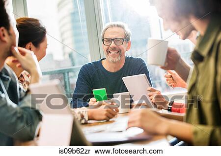 Digital design team having meeting in office View Large Photo Image Stock Photography - Digital design team having meeting in office. Fotosearch
