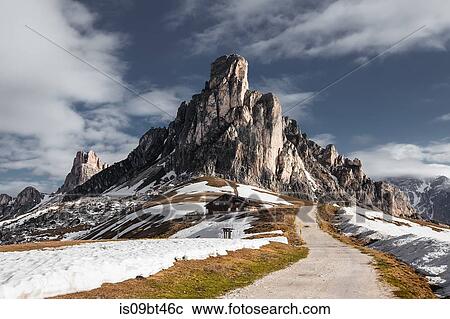 Dirt track in snow capped mountains, Dolomites, Italy View Large Photo Image Stock Image - Dirt track in snow capped mountains, Dolomites, Italy. Fotosearch