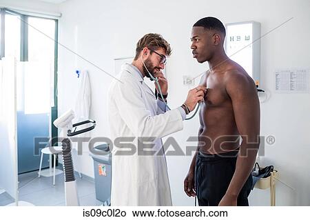 Doctor examining patient in consultation room View Large Photo Image Picture - Doctor examining patient in consultation room. Fotosearch