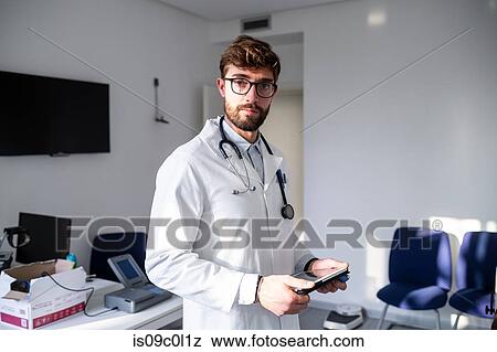 Stock Photo - Doctor in consultation room. Fotosearch