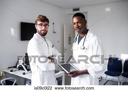 Doctors in consultation room View Large Photo Image Stock Image - Doctors in consultation room. Fotosearch