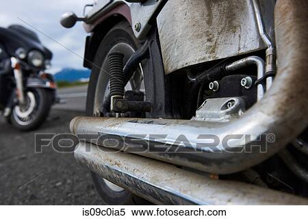 Exhaust pipes of motorcycle covered in dirt View Large Photo Image Stock Photography - Exhaust pipes of motorcycle covered in dirt. Fotosearch