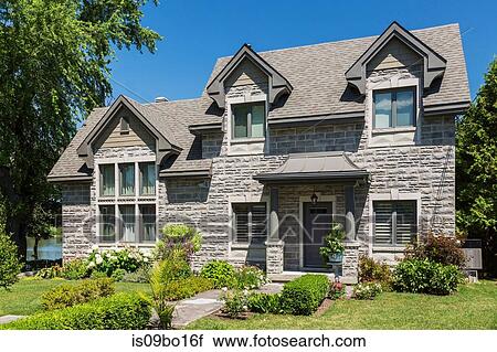 Facade of contemporary brick house facade with nuanced asphalt shingle roof and front garden View Large Photo Image Stock Image - Facade of contemporary brick house facade with nuanced asphalt shingle roof and front garden. Fotosearch