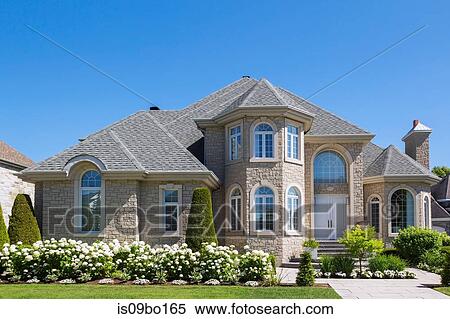 Facade of luxurious house in beige stone with front garden View Large Photo Image Stock Photography - Facade of luxurious house in beige stone with front garden. Fotosearch
