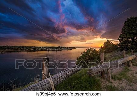 Fading supercell over lake at sunset, Ogallala, Nebraska, US View Large Photo Image Stock Photograph - Fading supercell over lake at sunset, Ogallala, Nebraska, US. Fotosearch