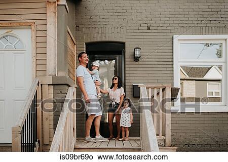 Family at front door of home View Large Photo Image Picture - Family at front door of home. Fotosearch