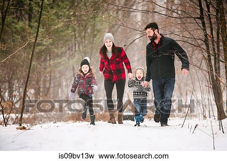 Family on walk in snow landscape View Large Photo Image Stock Photo - Family on walk in snow landscape. Fotosearch