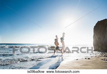 Family playing on El Matador Beach, Malibu, USA View Large Photo Image Stock Photo - Family playing on El Matador Beach, Malibu, USA. Fotosearch