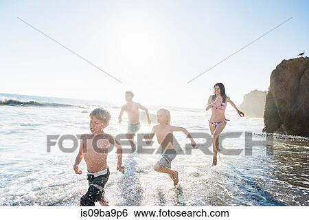Family playing on El Matador Beach, Malibu, USA View Large Photo Image Stock Photograph - Family playing on El Matador Beach, Malibu, USA. Fotosearch