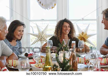 Family talking and bonding at home party View Large Photo Image Stock Image - Family talking and bonding at home party. Fotosearch
