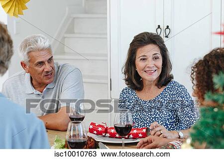 Family talking and bonding at home party View Large Photo Image Stock Image - Family talking and bonding at home party. Fotosearch
