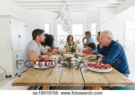 Family talking and bonding at home party View Large Photo Image Stock Photography - Family talking and bonding at home party. Fotosearch